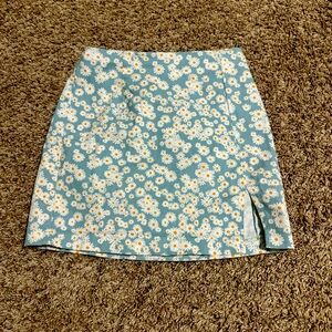 Blue skirt with daisy’s on it